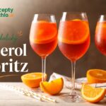 Nealko Aperol Spritz, jednoduchý recept hotový za 3 minúty Tri poháre nealkoholického oranžového spritzu s ľadom a pomarančom